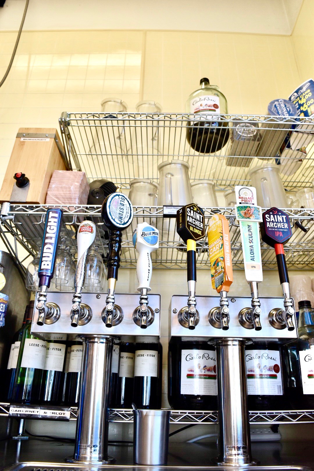 photo of diffrent types of beer on tap
